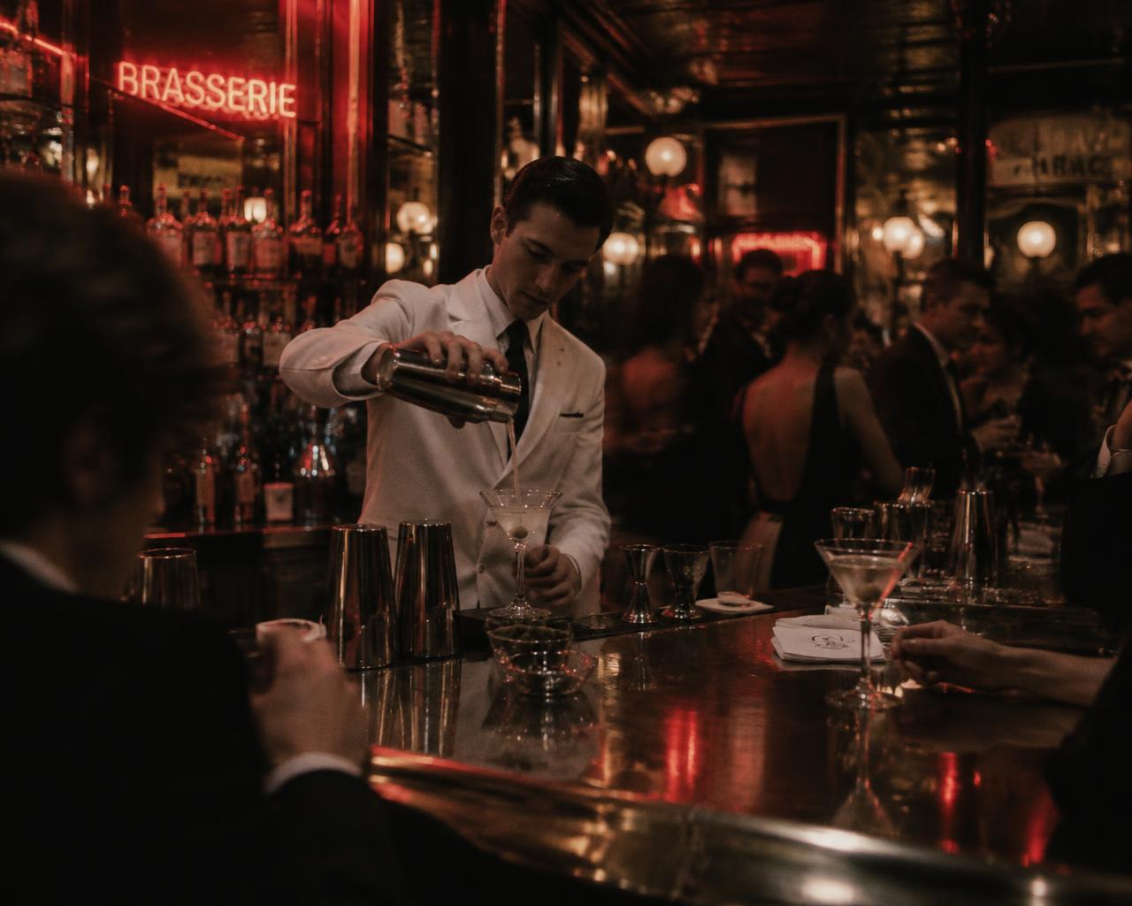 Bartender pouring a martini at the Odeon bar